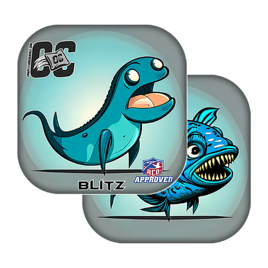 Two blue fish-shaped Cornhole bags with cartoon designs on a white background