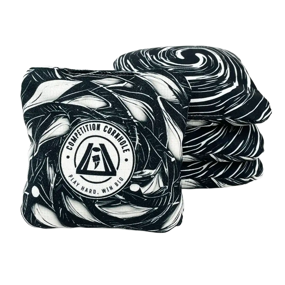 Two black and white patterned cornhole bags with a visible brand logo on a white background.
