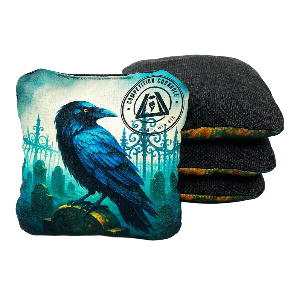 Cornhole bag with a blue raven design and a set of black and green wrist wraps on a white background.