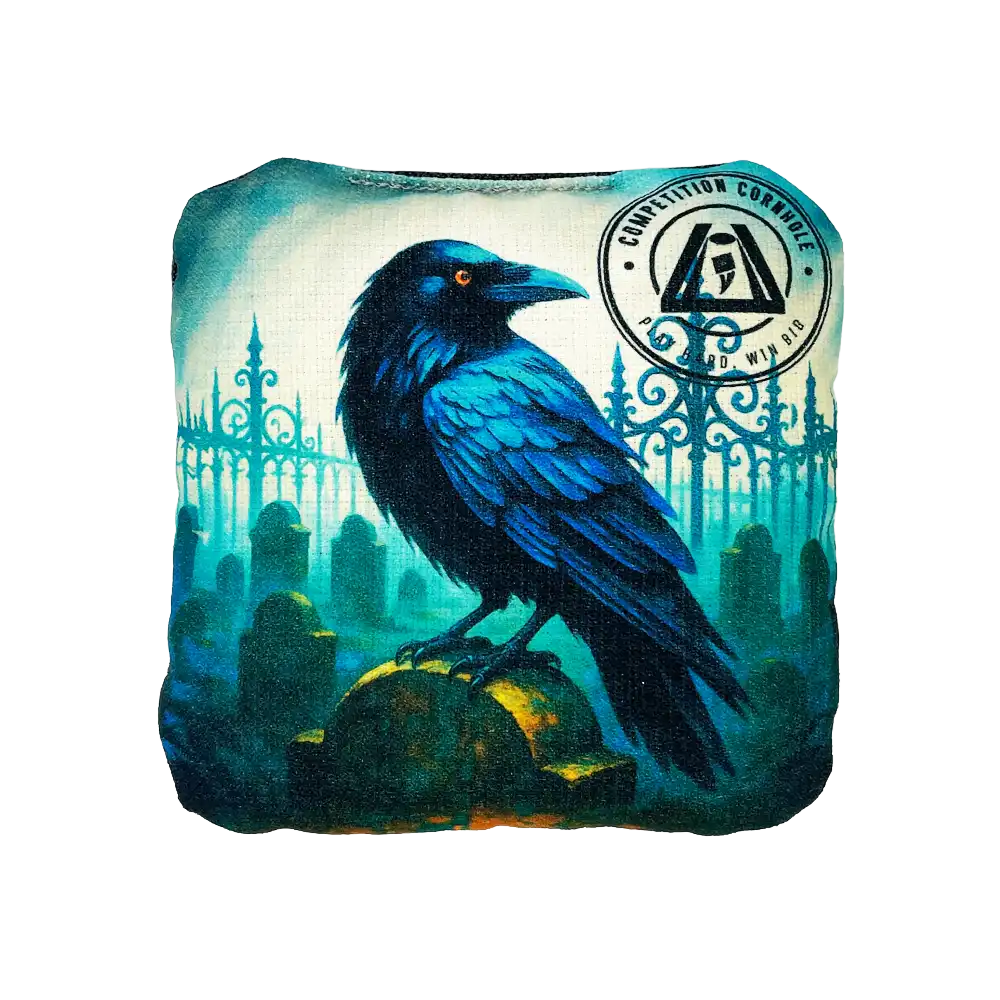cornhole bag with a blue raven design on a white background