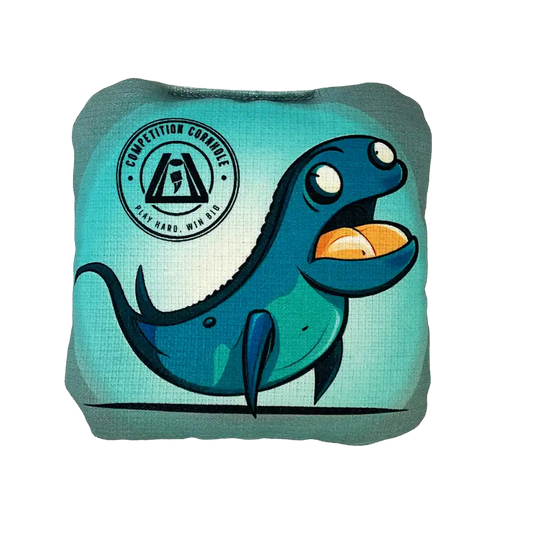 Blue dinosaur-shaped Cornhole bag with a logo on a white background