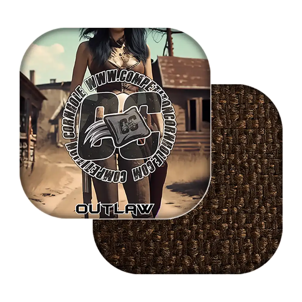 Cornhole bags with 'Outlaw' branding in a desert setting