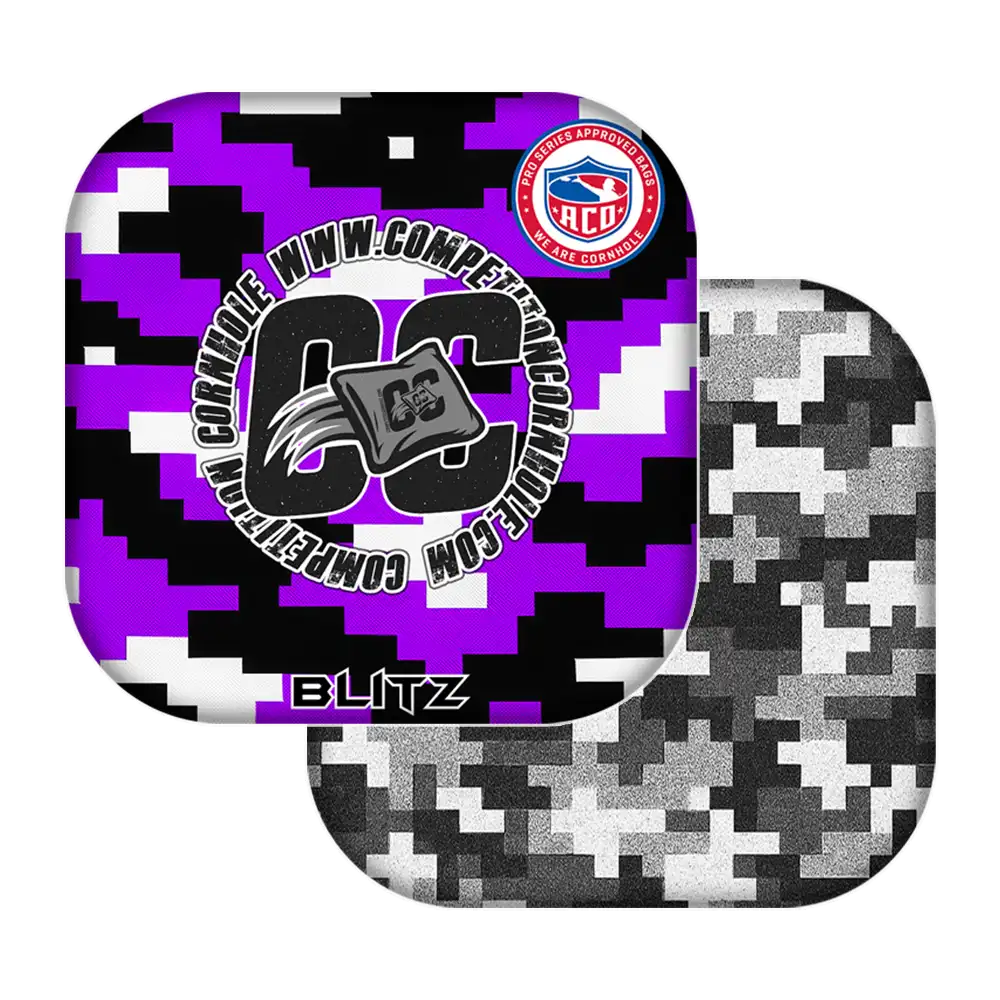 Two camouflage-patterned cornhole bags with visible branding on a white background