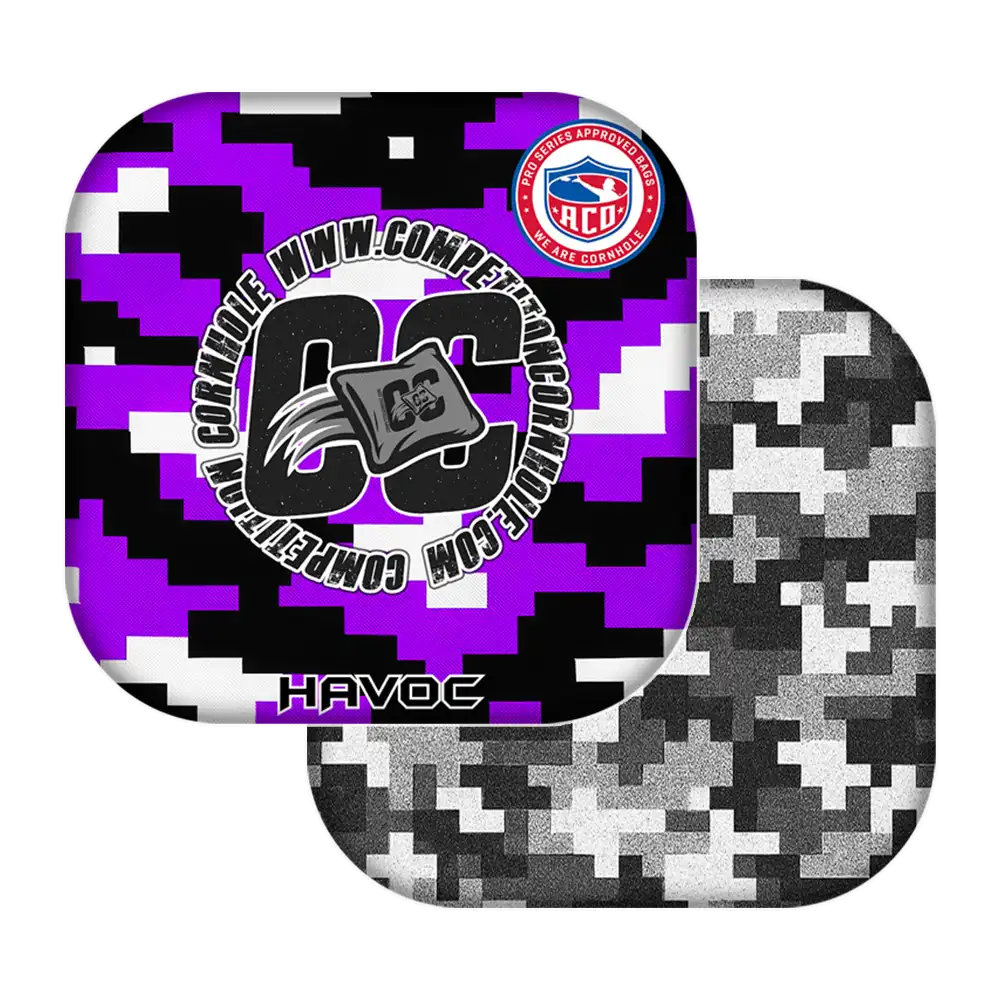 Two camouflage-patterned cornhole bags with visible branding on a white background