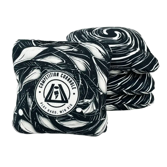 Two black and white patterned cornhole bags with a visible brand logo on a white background.