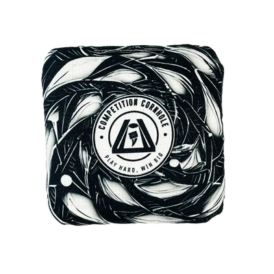 Cornhole bag with black and white abstract design and 'Competition Cornhole' logo on a white background