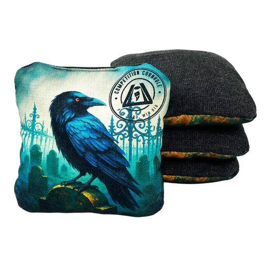 Cornhole bag with a blue raven design and a set of black and green wrist wraps on a white background.
