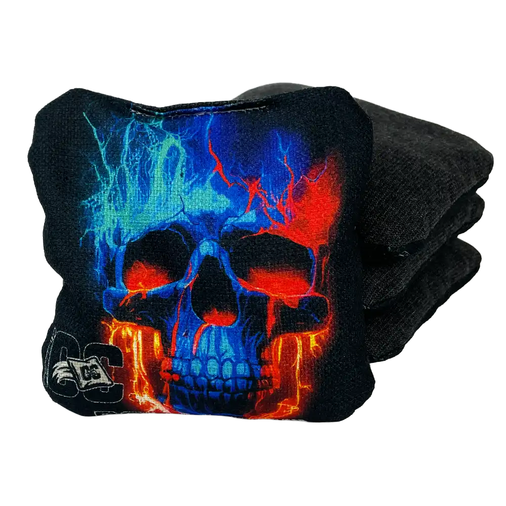 Cornhole bags with colorful skull design on a white background